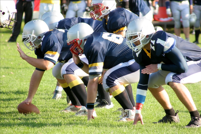 football players, offense – defense in action